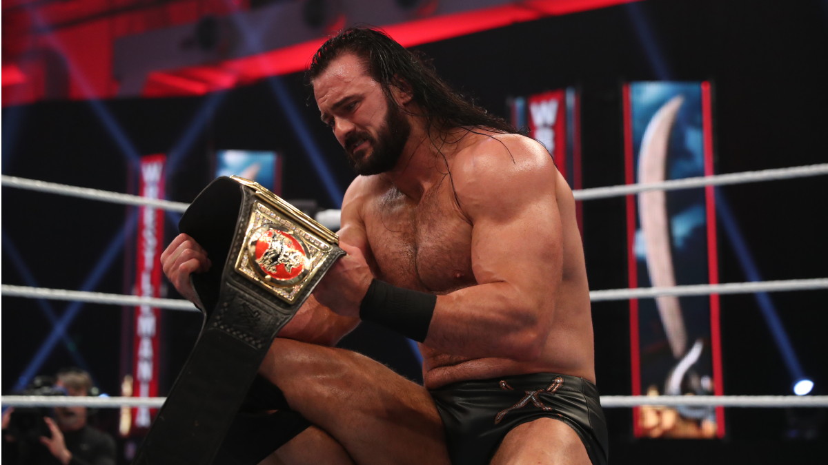 Caption from the book: A surreal moment, gazing into the WWE Championship title belt - my WWE Championship belt - still not fully believing I had won it! All book photos courtesy of Simon & Schuster.