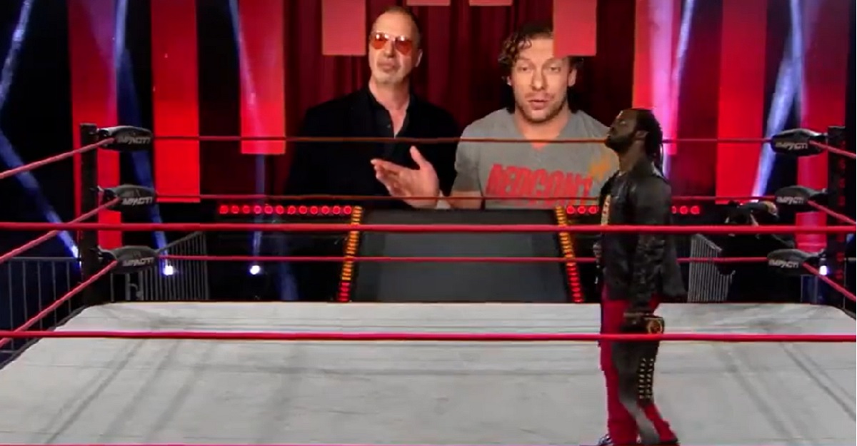 Rich Swann listens to Don Callis and Kenny Omega during a pandemic-era Impact taping.