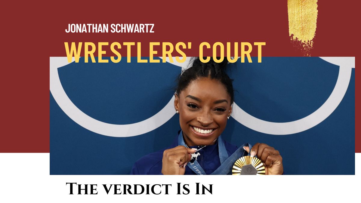 Simone Biles with her gold medal and a 