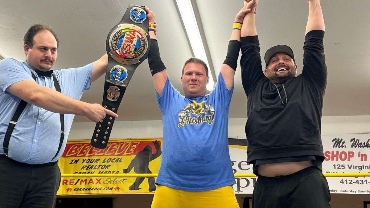 Referee Jimmy James holds up the hand of then-KSWA Champion Lou Martin alongside former Pittsburgh Pirates catcher Michael McKendry at KSWA FanFest 2023. Photo by Tim Steiner