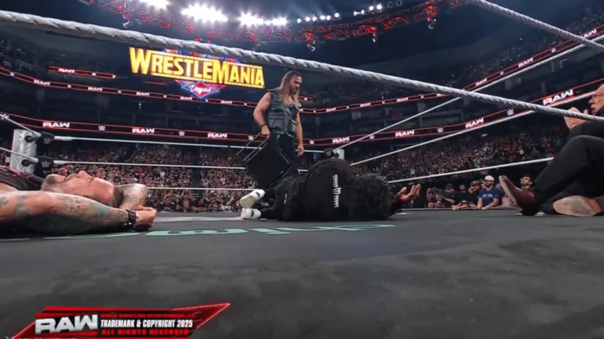 Rollins stands tall after smashing Roman with a chair.