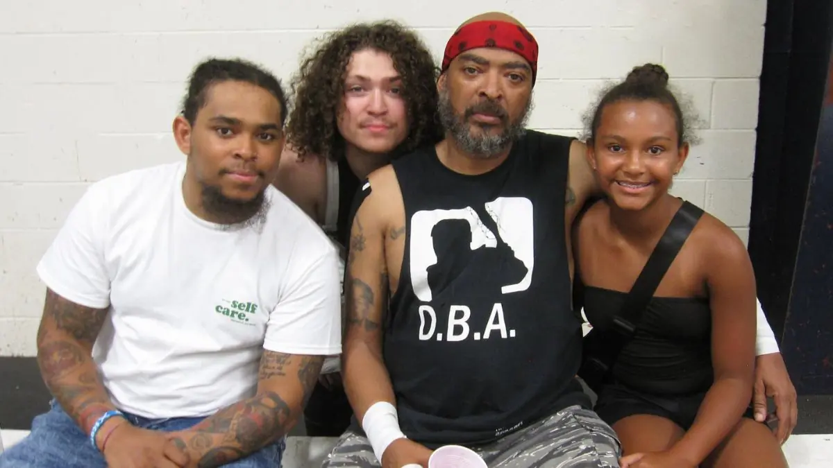 Malcolm Monroe II with sons Malcolm Monroe III and Caden Monroe and daughter MaKayla, 2025. Photo by Brad McFarlin.